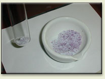 The mixture of cobalt(II) chloride and aluminum chloride is being homogenized
